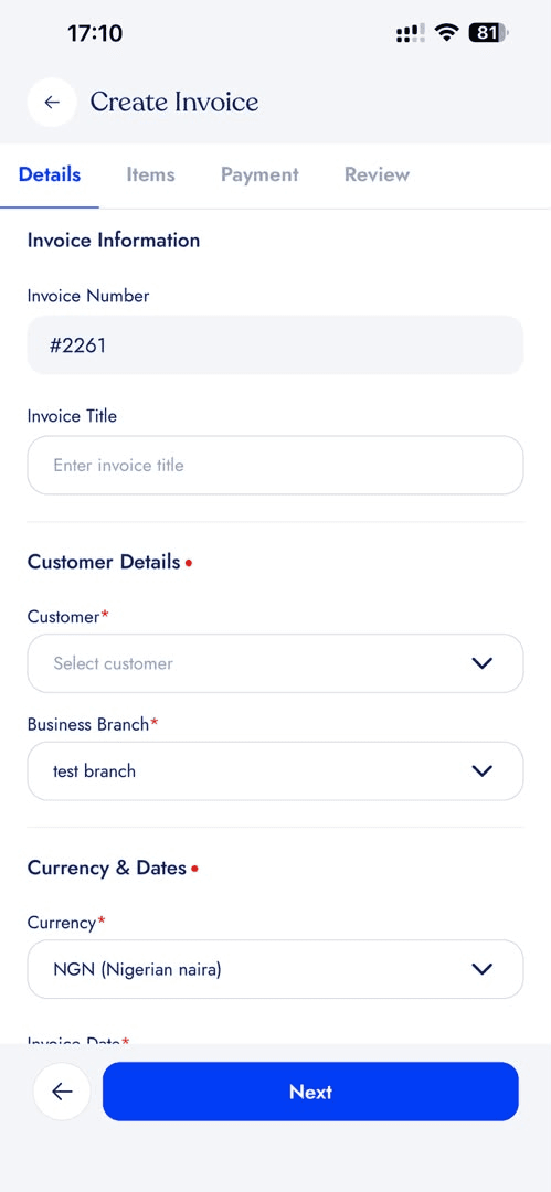 Create-invoice wizard on the details step, with tabs for details, items, payment and review above fields for invoice number, title, customer, business branch and currency