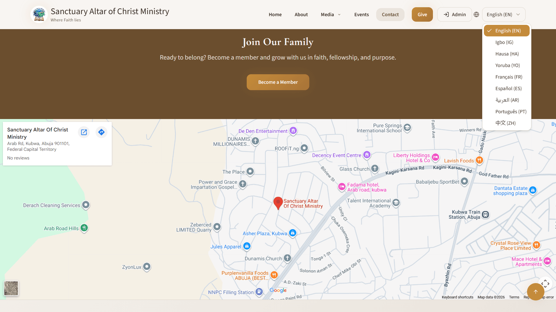 Public site with the language menu open showing nine options including Igbo, Hausa and Yoruba, above a Google map of the church in Kubwa, Abuja